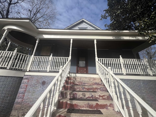 property entrance with a porch