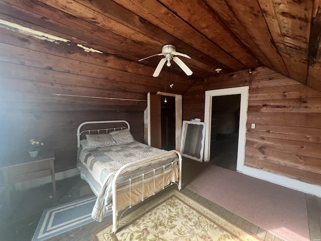 bedroom featuring wood ceiling, wooden walls, and vaulted ceiling