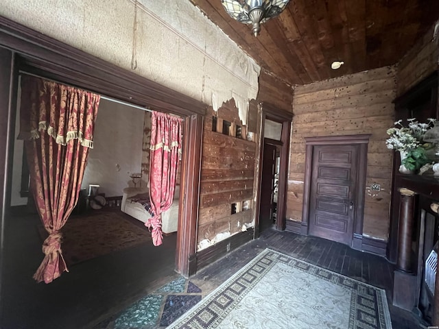 interior space featuring wood walls and wood ceiling