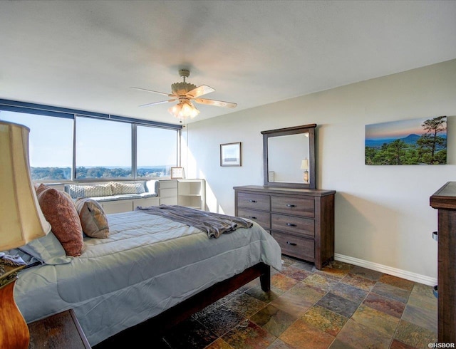 740 Weston Rd Unit B-804, Hot Springs, AR 71913 - bedroom with baseboards, a ceiling fan, and stone tile flooring