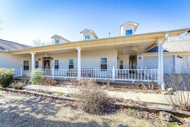 view of front facade featuring covered porch, an attached garage, and a ceiling fan