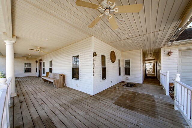 wooden terrace featuring ceiling fan