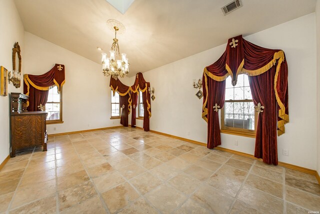 unfurnished room with a wealth of natural light, visible vents, and baseboards