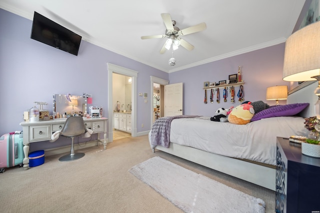 bedroom featuring ceiling fan, baseboards, carpet, ensuite bath, and crown molding