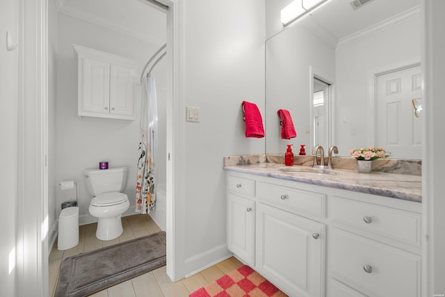 bathroom featuring toilet, wood finished floors, vanity, baseboards, and ornamental molding