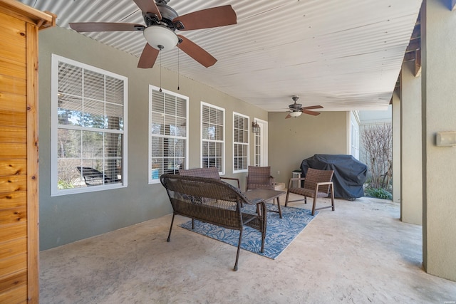 view of patio with a ceiling fan and a grill