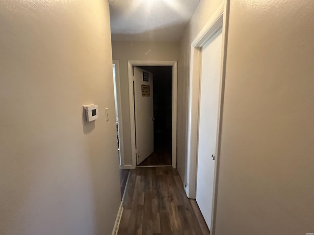 102 King Arthur Ct, Hot Springs, AR 71913 - hallway featuring dark wood-style flooring and baseboards