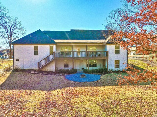 back of property with stairway and a wooden deck