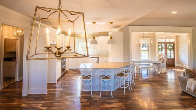 kitchen with white cabinets, hanging light fixtures, and dishwasher