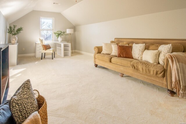 carpeted living area featuring vaulted ceiling, visible vents, and baseboards