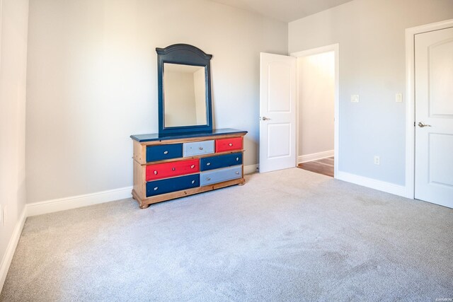 carpeted bedroom with baseboards