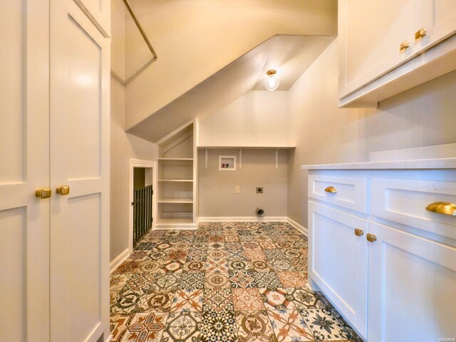 washroom featuring baseboards, hookup for a washing machine, cabinet space, and hookup for an electric dryer