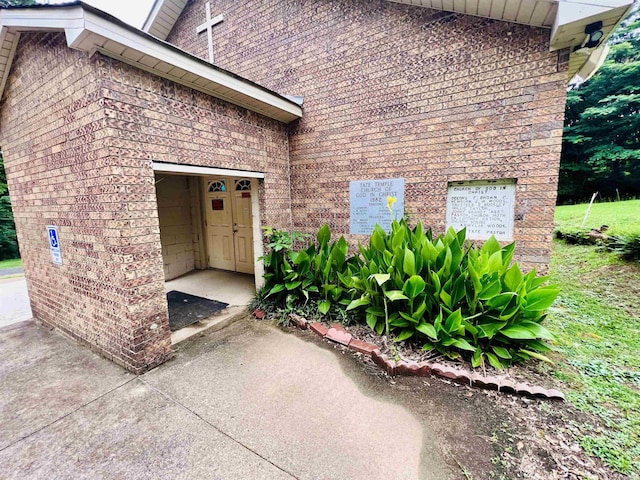 entrance to property with brick siding