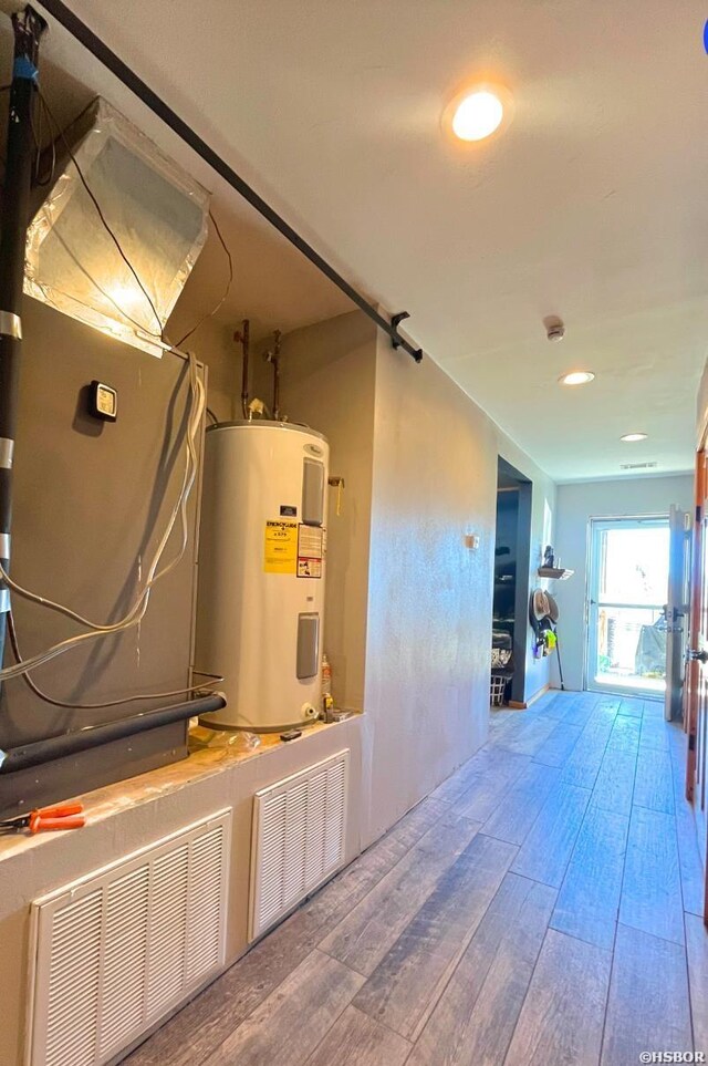 utility room with water heater