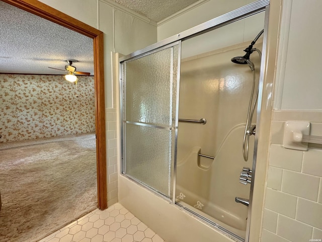 full bath with ornamental molding, shower / bath combination with glass door, a textured ceiling, and a ceiling fan