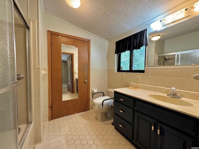 bathroom with lofted ceiling, toilet, a textured ceiling, vanity, and tile walls