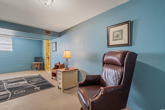 108 Helen St, Hot Springs, AR 71913 - sitting room featuring finished concrete flooring, visible vents, and concrete block wall