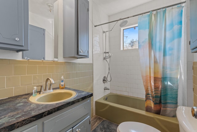 108 Helen St, Hot Springs, AR 71913 - full bathroom with decorative backsplash, toilet, shower / bathtub combination with curtain, vanity, and tile walls