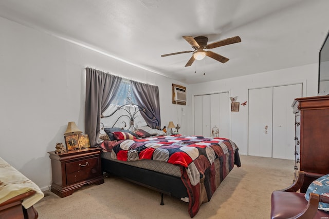 108 Helen St, Hot Springs, AR 71913 - carpeted bedroom featuring ceiling fan, an AC wall unit, and two closets