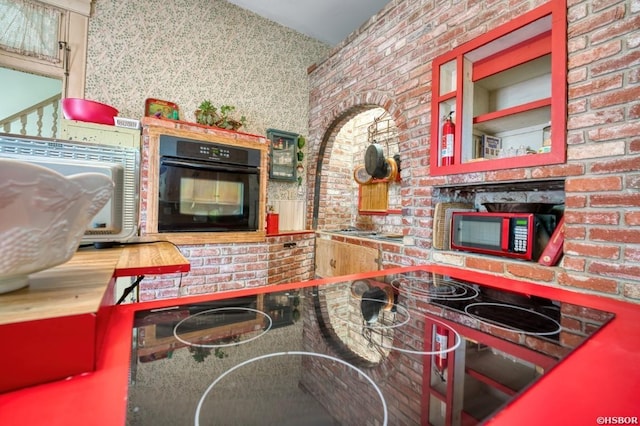 kitchen featuring black oven