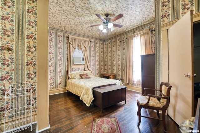 bedroom with wallpapered walls, baseboards, and dark wood-style flooring