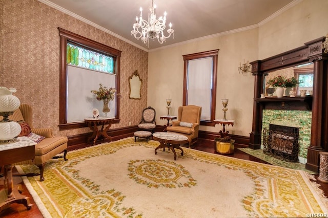 living area featuring wallpapered walls, baseboards, a tile fireplace, ornamental molding, and wood finished floors