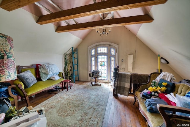 living area featuring electric panel, a notable chandelier, lofted ceiling with beams, and wood finished floors