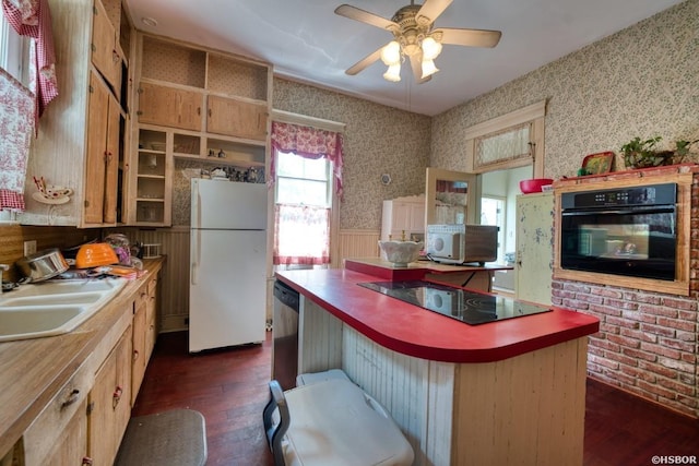 kitchen featuring open shelves, a sink, dark wood-style floors, black appliances, and wallpapered walls