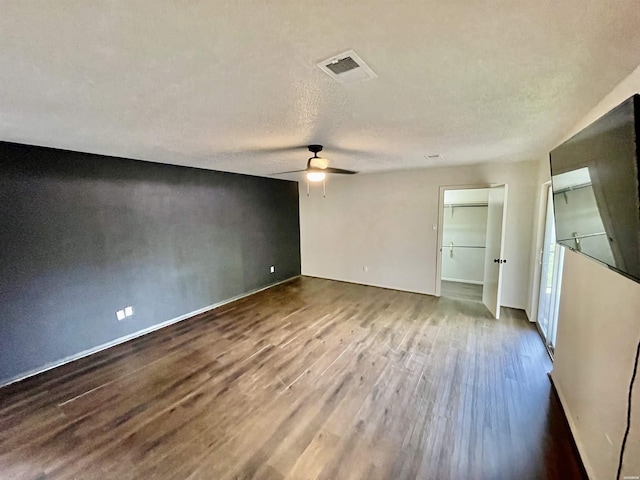 1135 Twin Pts Unit C, Hot Springs, AR 71913 - unfurnished bedroom featuring wood finished floors, ceiling fan, and a textured ceiling
