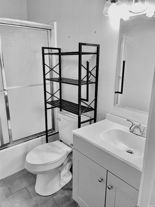1135 Twin Pts Unit C, Hot Springs, AR 71913 - full bath with vanity, combined bath / shower with glass door, a textured wall, and tile patterned flooring