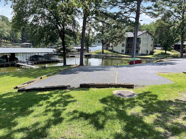 1135 Twin Pts Unit C, Hot Springs, AR 71913 - view of green lawn with a water view and a boat dock