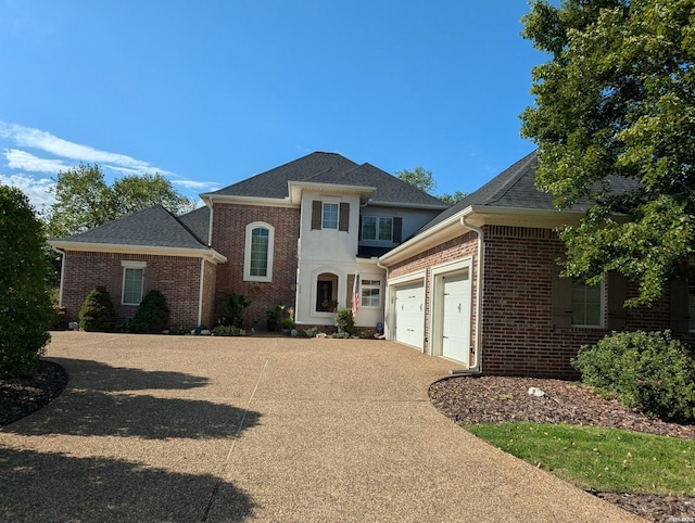 203 Carriage Creek Ct, Hot Springs, AR 71901 - view of front facade with brick siding, an attached garage, and driveway