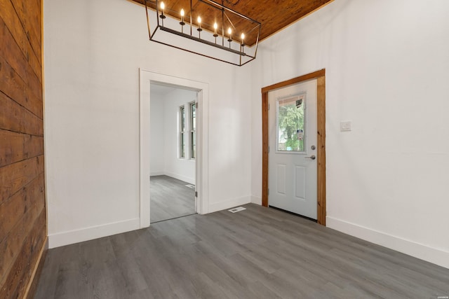 207 Hagen St, Hot Springs, AR 71913 - entrance foyer with a chandelier, baseboards, dark wood-style floors, and wooden ceiling