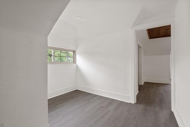 207 Hagen St, Hot Springs, AR 71913 - unfurnished room featuring vaulted ceiling, wood finished floors, and baseboards