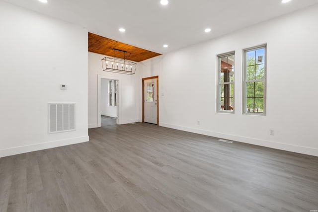 207 Hagen St, Hot Springs, AR 71913 - unfurnished living room with baseboards, visible vents, wood finished floors, and recessed lighting