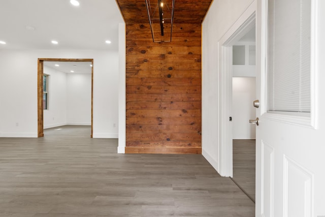 207 Hagen St, Hot Springs, AR 71913 - corridor featuring wooden walls, recessed lighting, light wood-style flooring, and baseboards
