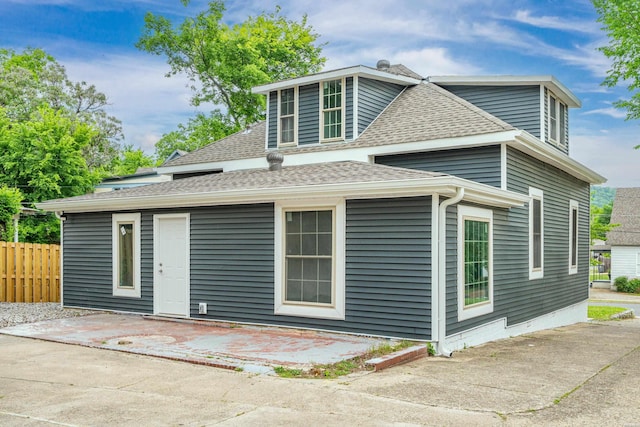 207 Hagen St, Hot Springs, AR 71913 - view of home's exterior with fence, roof with shingles, and a patio