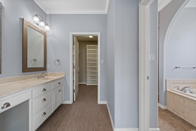 220 Mcdonald Loop, Hot Springs, AR 71913 - bathroom with vanity, a garden tub, crown molding, and a spacious closet