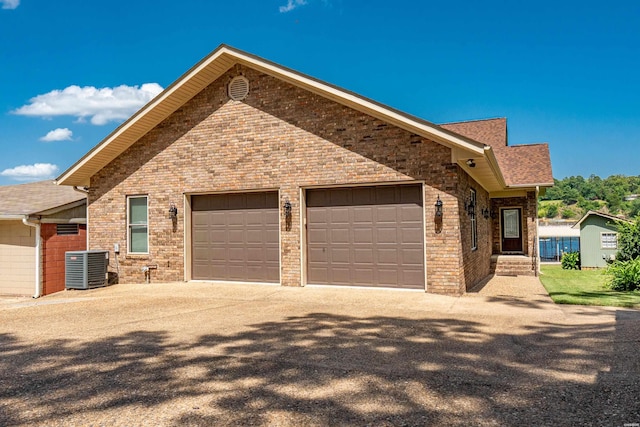 220 Mcdonald Loop, Hot Springs, AR 71913 - view of front of house with driveway, an attached garage, roof with shingles, and brick siding