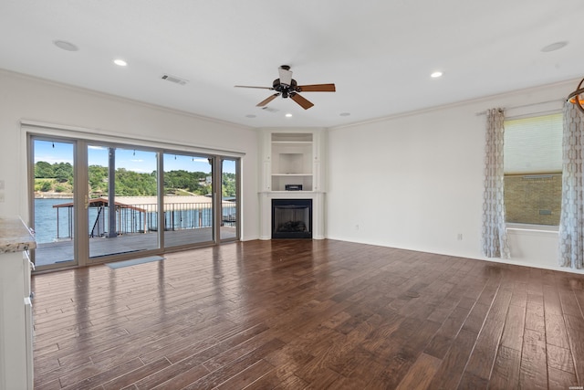 220 Mcdonald Loop, Hot Springs, AR 71913 - unfurnished living room with dark wood-style floors, ceiling fan, crown molding, built in shelves, and a fireplace