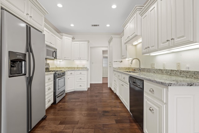 220 Mcdonald Loop, Hot Springs, AR 71913 - kitchen featuring appliances with stainless steel finishes, white cabinets, dark wood-style floors, recessed lighting, and light stone countertops