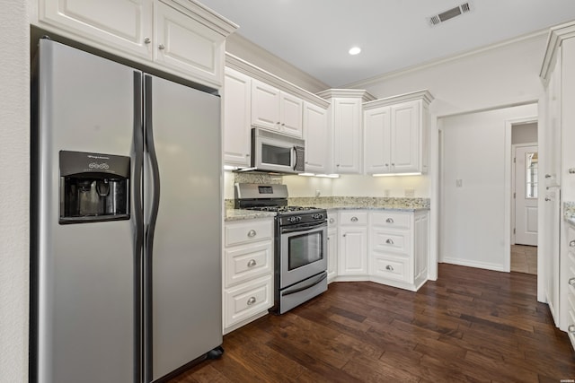 220 Mcdonald Loop, Hot Springs, AR 71913 - kitchen with appliances with stainless steel finishes, white cabinets, light stone counters, dark wood finished floors, and recessed lighting