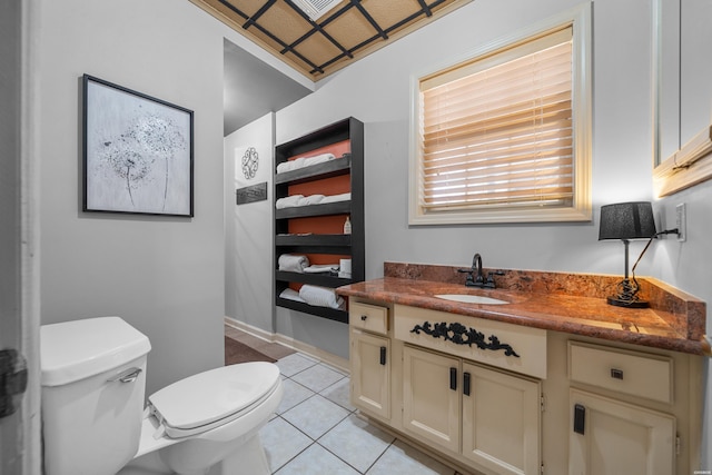 half bathroom featuring baseboards, toilet, tile patterned flooring, and vanity