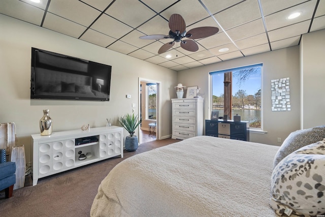 bedroom featuring a ceiling fan, carpet floors, recessed lighting, and a paneled ceiling