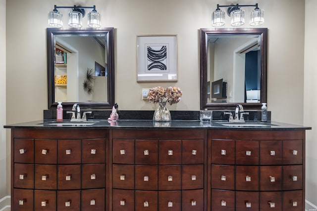 full bath with double vanity and a sink