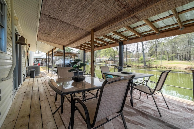 wooden terrace with central AC and outdoor dining space