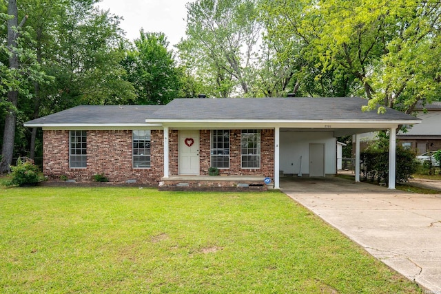 ranch-style house featuring brick siding, an attached carport, driveway, and a front yard