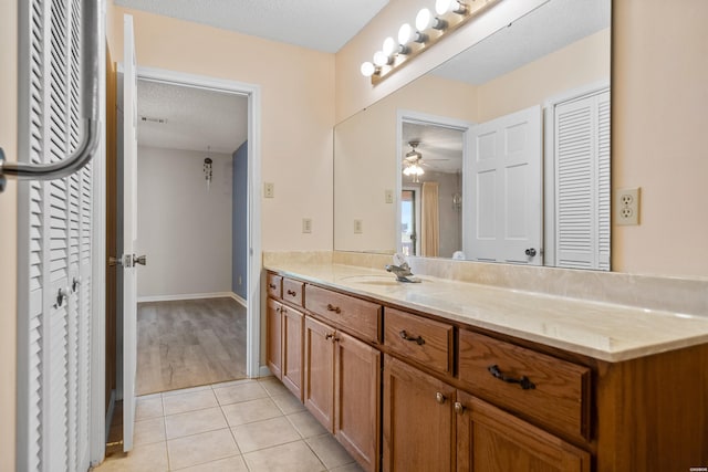 724 Weston Rd Unit Q-4, Hot Springs, AR 71913 - bathroom featuring vanity, a closet, a ceiling fan, tile patterned floors, and a textured ceiling