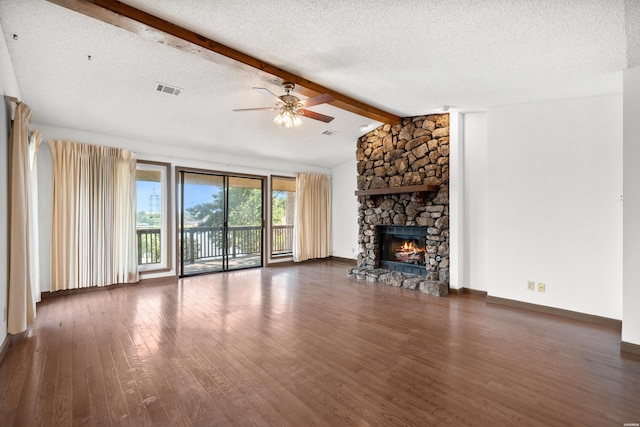 724 Weston Rd Unit Q-4, Hot Springs, AR 71913 - unfurnished living room with wood finished floors, a ceiling fan, a fireplace, and a textured ceiling