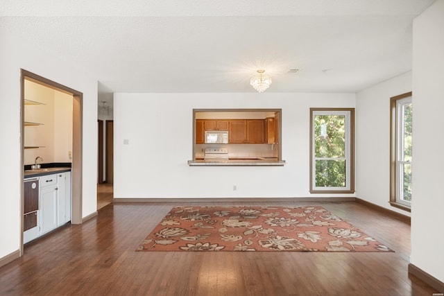 724 Weston Rd Unit Q-4, Hot Springs, AR 71913 - unfurnished living room featuring dark wood-type flooring and a chandelier